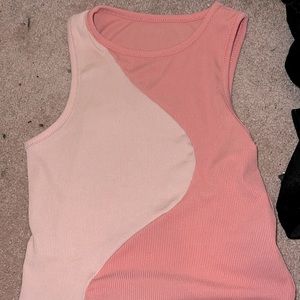 This is a top and it’s pink and white